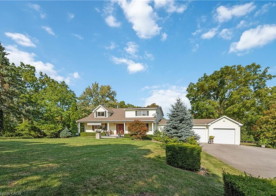 493 Ridge Road East surrounded by mature trees